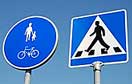 Road signs giving priority to cyclists and pedestrians